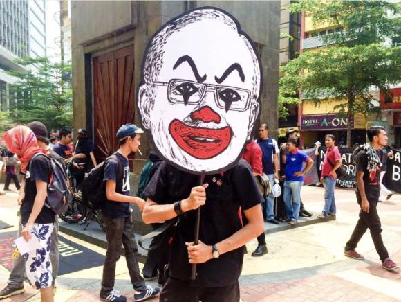 Figure 13: Following his arrest, Fahmi posted the image once again to social media and explained why he chose the imagery of the clown and what this image represents. Screenshot by TaSC.